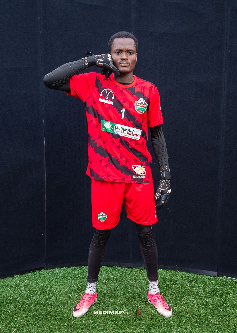 Medimafo Football Academy goalkeeper in the red kit at media day